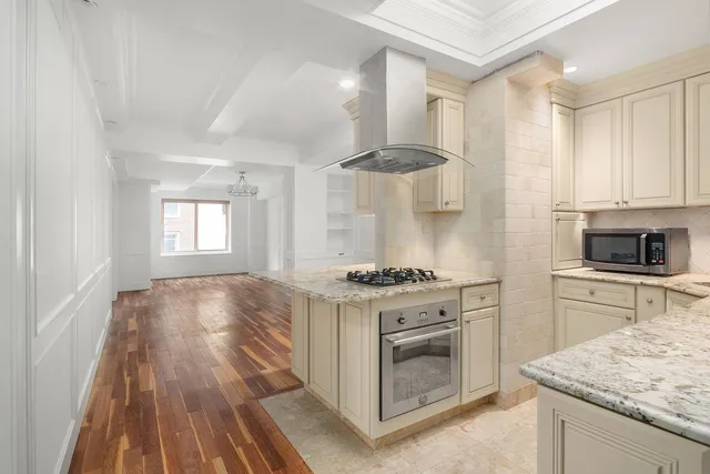 a kitchen with a stove oven and sink