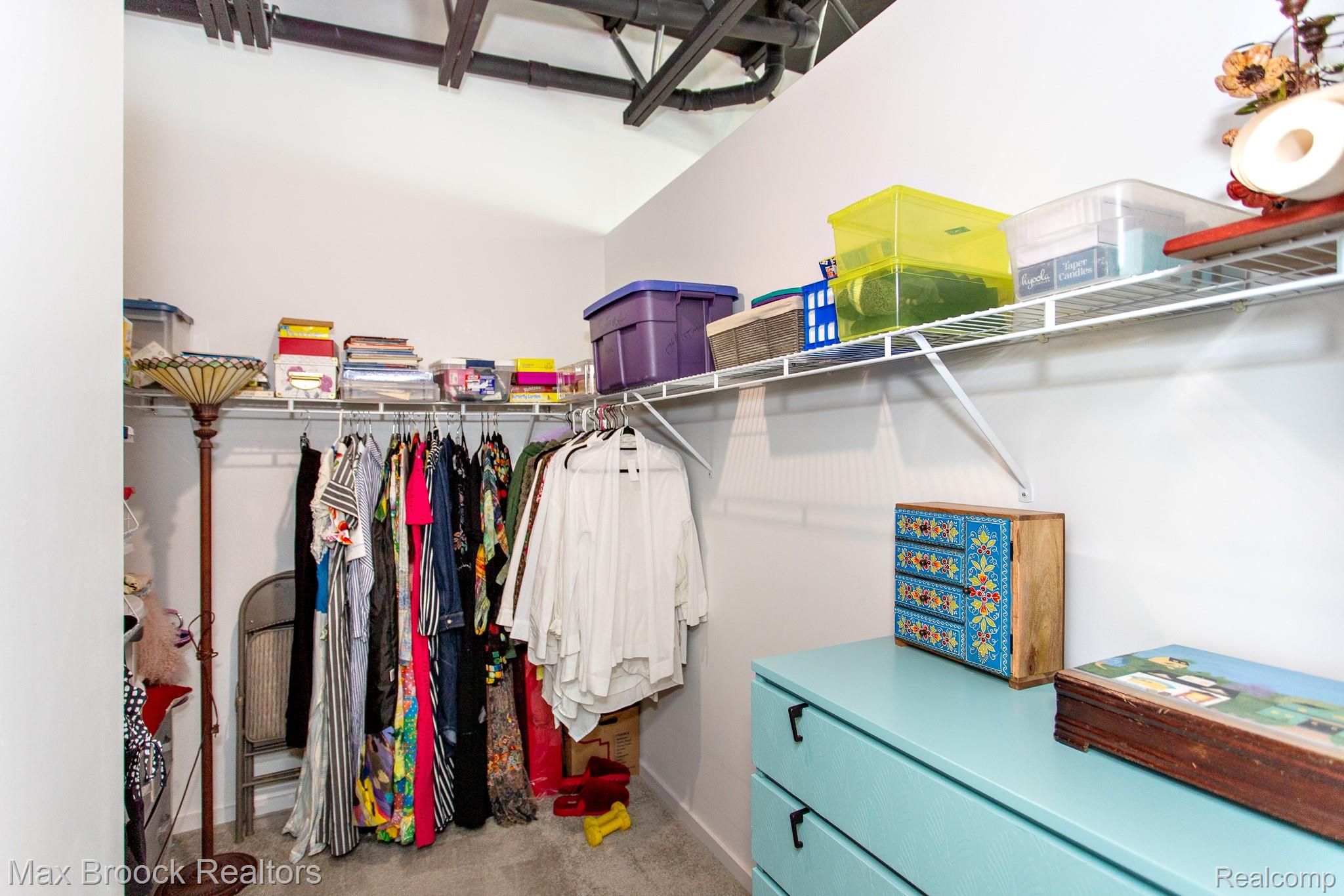 211 East 9 Mile Road, Unit 307 Ferndale, MI 48220 - Photo 38 of 60 Walk in closet featuring light colored carpet