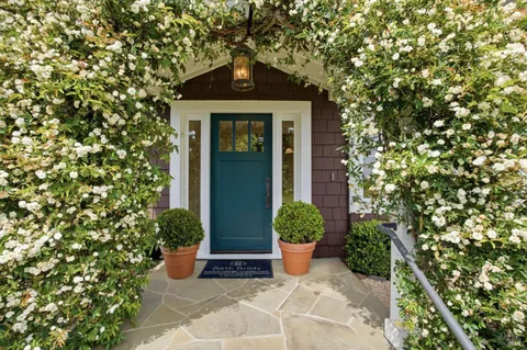 a front view of a house with a yard