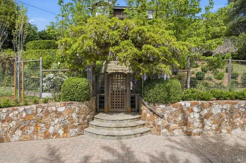 a view of a house with a tree
