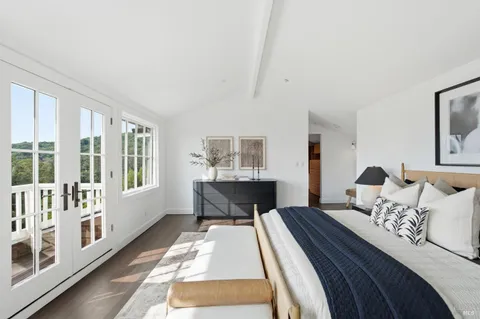 a bed room with two bed and a window