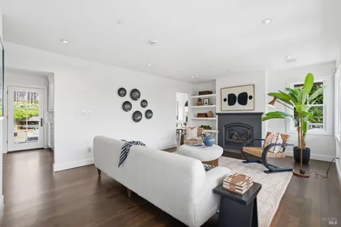 a balcony with furniture and wooden floor