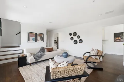 a large kitchen with a large window and stainless steel appliances