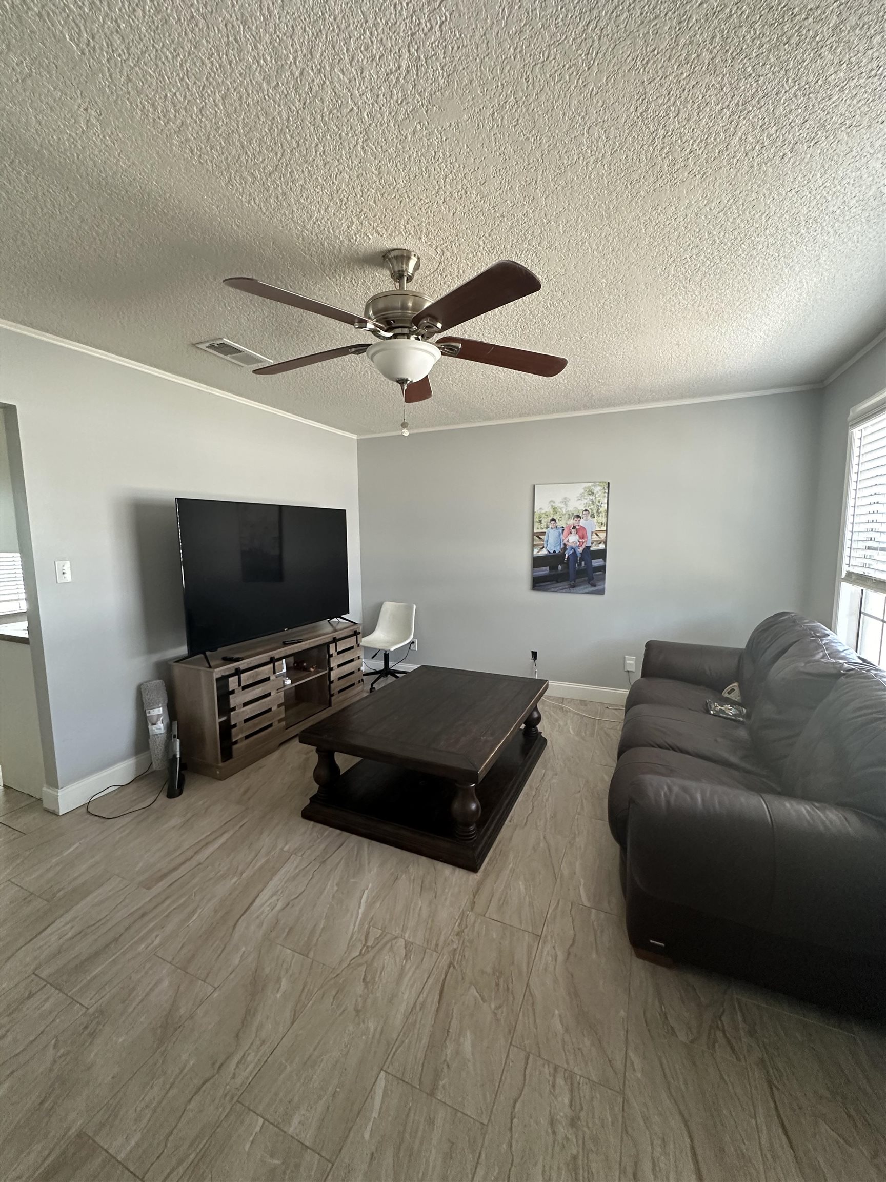6659 Brevard Street St. Augustine, FL 32080 - Photo 21 of 27 a living room with furniture and a flat screen tv