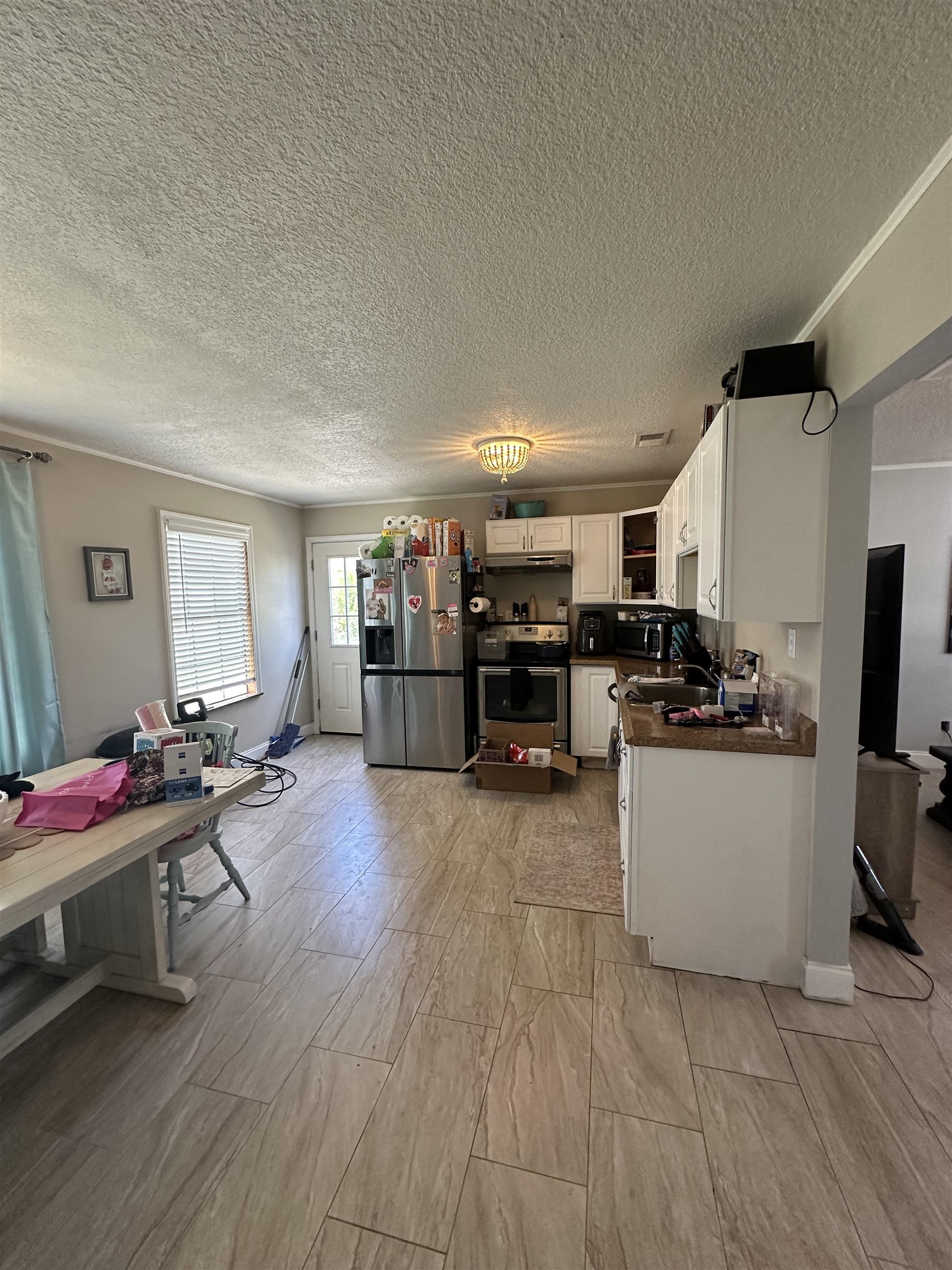 6659 Brevard Street St. Augustine, FL 32080 - Photo 22 of 27 a living room with furniture and a flat screen tv