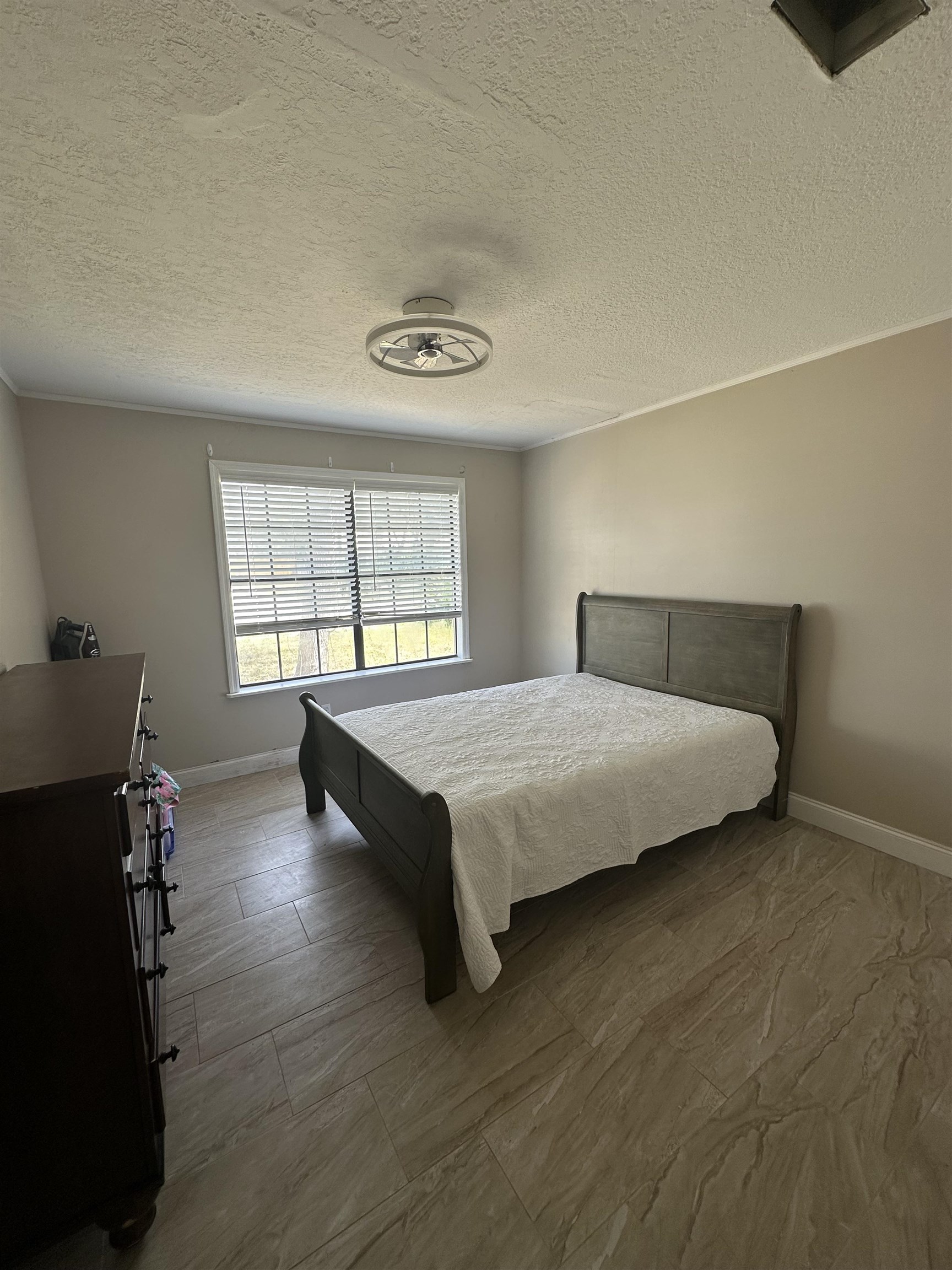 6659 Brevard Street St. Augustine, FL 32080 - Photo 23 of 27 a bedroom with a bed and a window