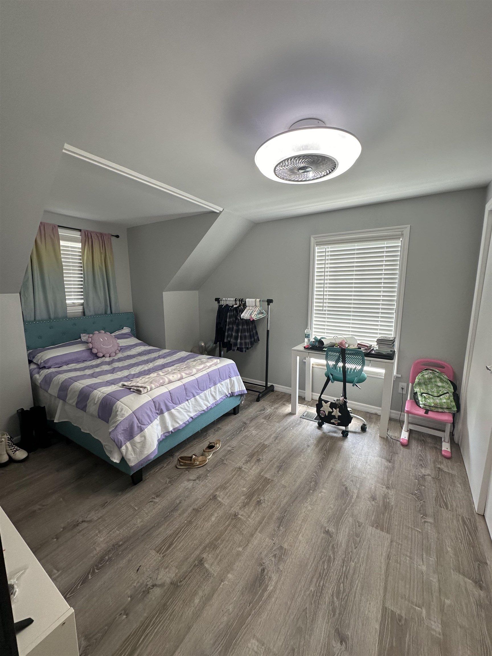 6659 Brevard Street St. Augustine, FL 32080 - Photo 26 of 27 a bedroom with a bed a table and a chandelier