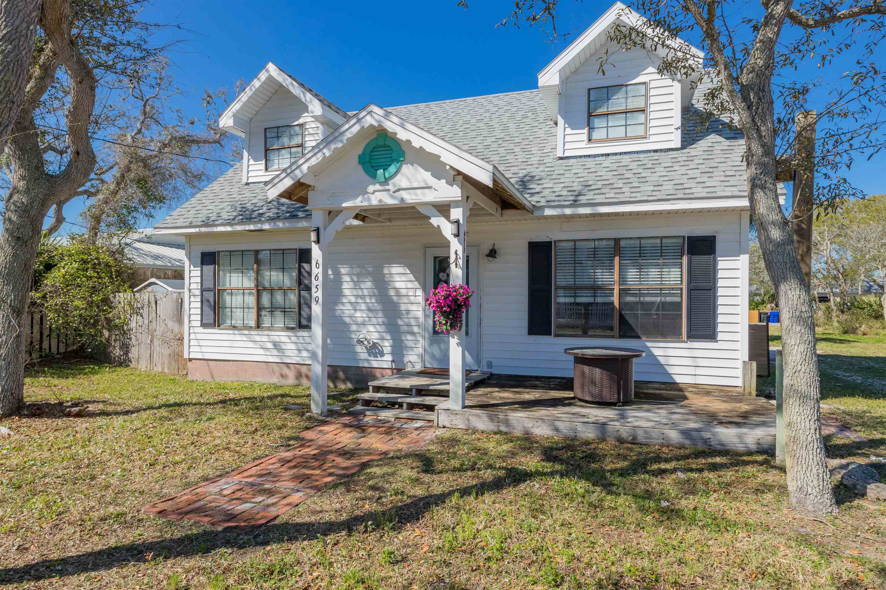 6659 Brevard Street St. Augustine, FL 32080 - Photo 5 of 27 a front view of a house with garden