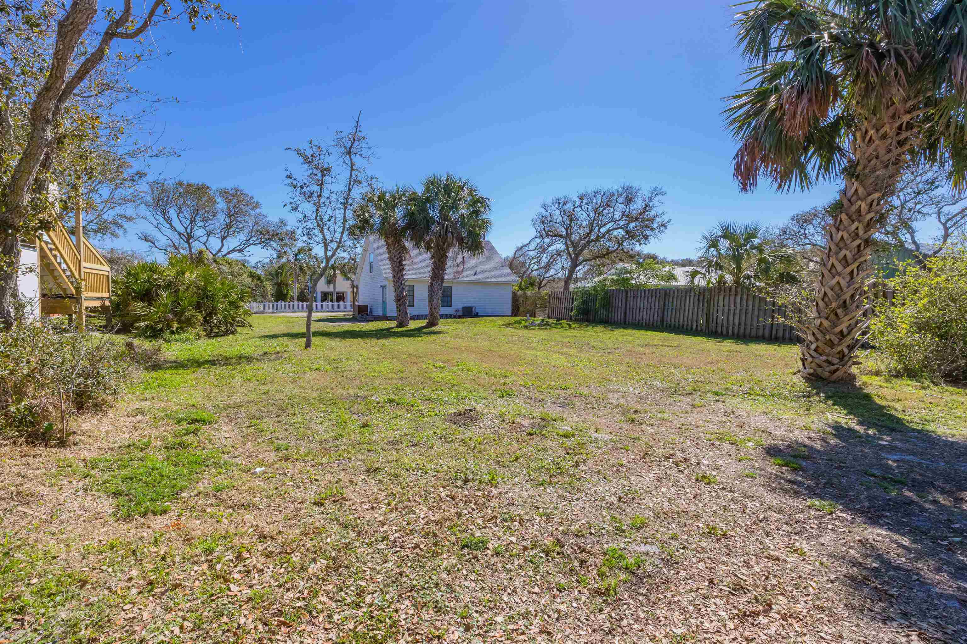 6659 Brevard Street St. Augustine, FL 32080 - Photo 7 of 27 a view of a yard with palm trees