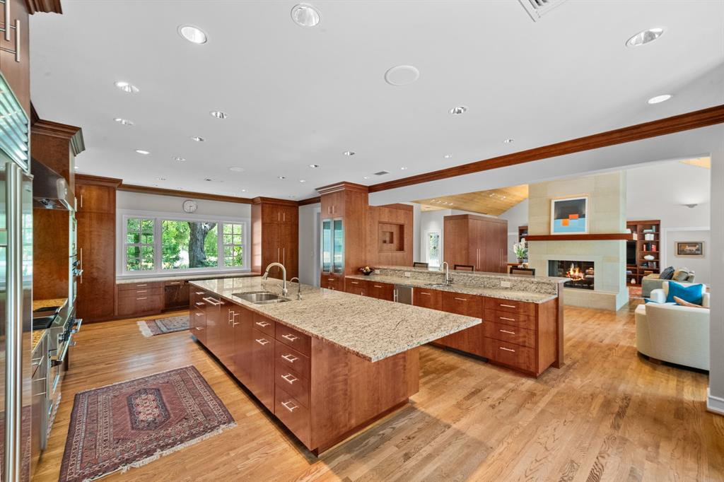 8055 Eagle Mountain Circle Fort Worth, TX 76135 - Photo 11 of 40 a large living room with stainless steel appliances granite countertop a couch and a large window