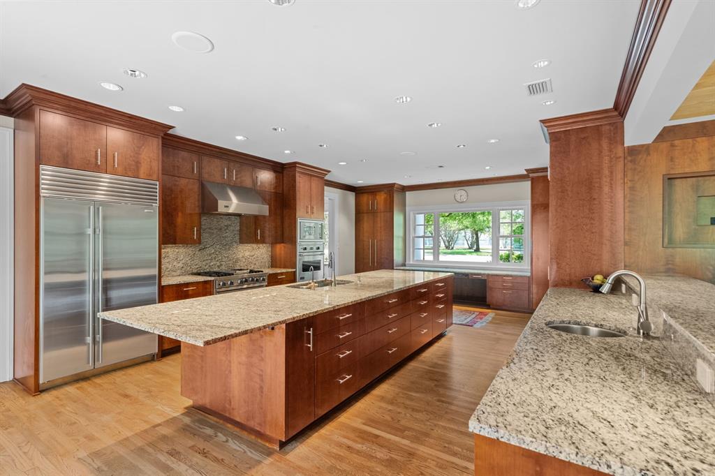 8055 Eagle Mountain Circle Fort Worth, TX 76135 - Photo 12 of 40 a large bedroom with a large bed and large windows