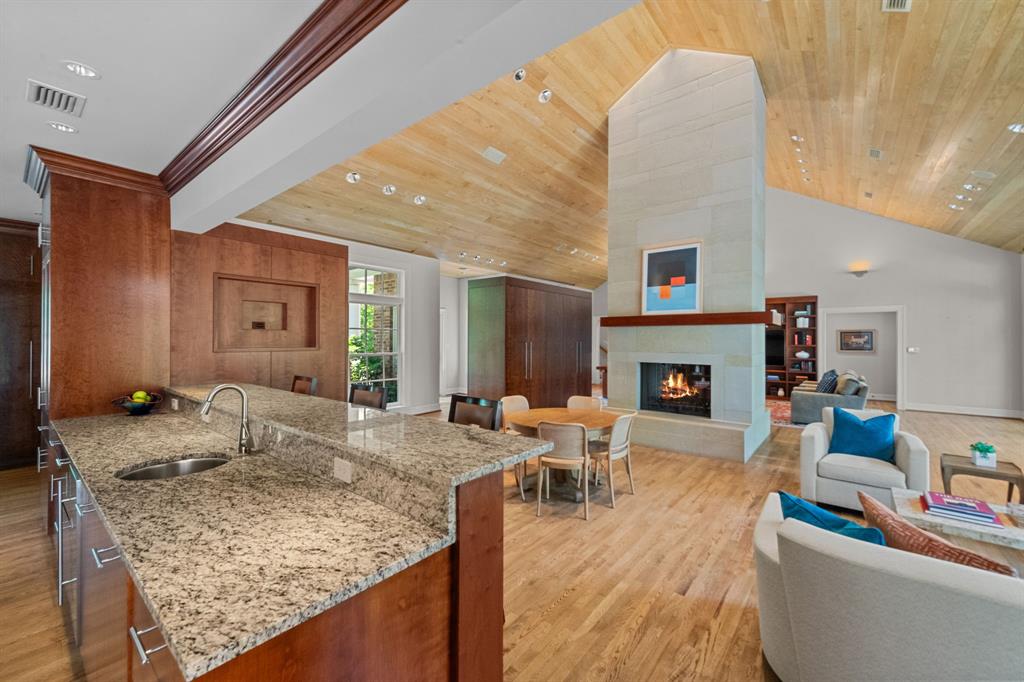 8055 Eagle Mountain Circle Fort Worth, TX 76135 - Photo 13 of 40 a living room with fireplace furniture and a wooden floor