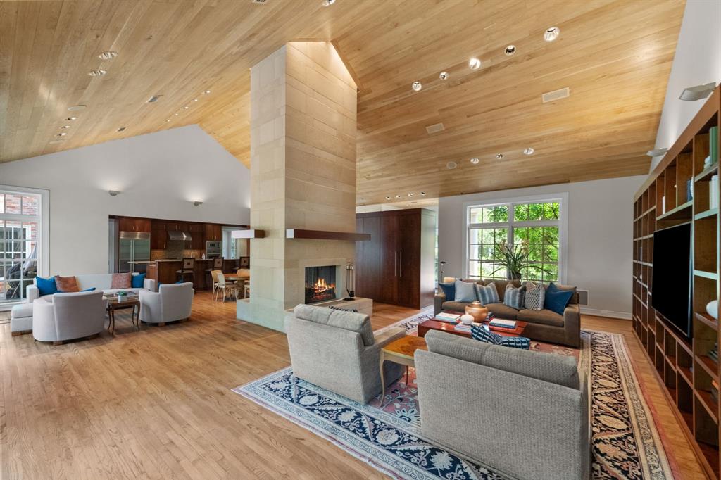 8055 Eagle Mountain Circle Fort Worth, TX 76135 - Photo 17 of 40 a living room with fireplace furniture and a flat screen tv