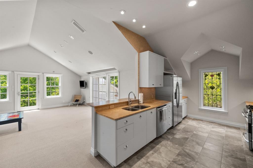 8055 Eagle Mountain Circle Fort Worth, TX 76135 - Photo 24 of 40 a kitchen with a sink a counter top space and stainless steel appliances
