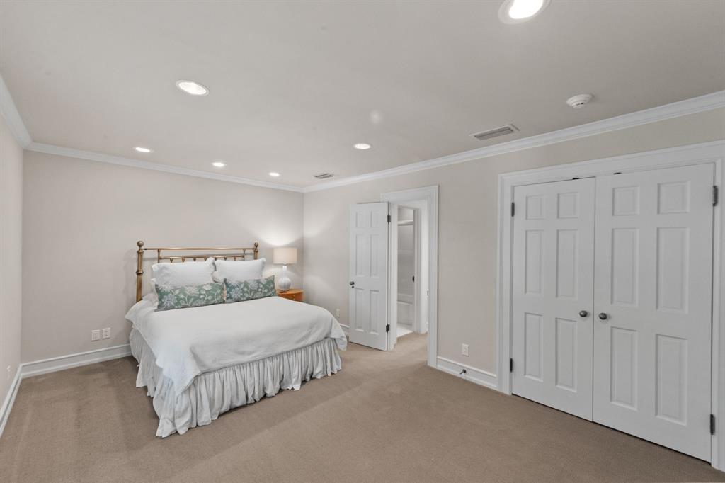 8055 Eagle Mountain Circle Fort Worth, TX 76135 - Photo 26 of 40 a bedroom with a bed and a night stand