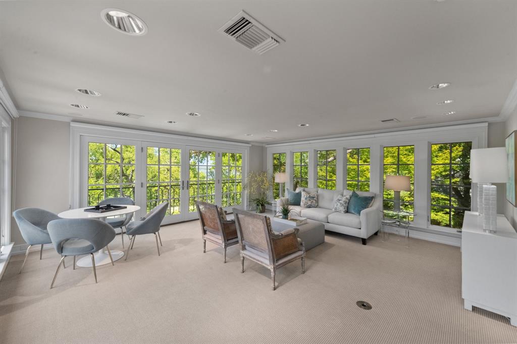 8055 Eagle Mountain Circle Fort Worth, TX 76135 - Photo 28 of 40 a living room with furniture and large windows