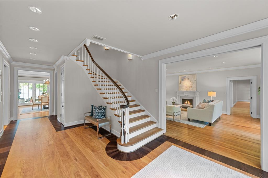 8055 Eagle Mountain Circle Fort Worth, TX 76135 - Photo 5 of 40 a view of a living room and entryway with wooden floor