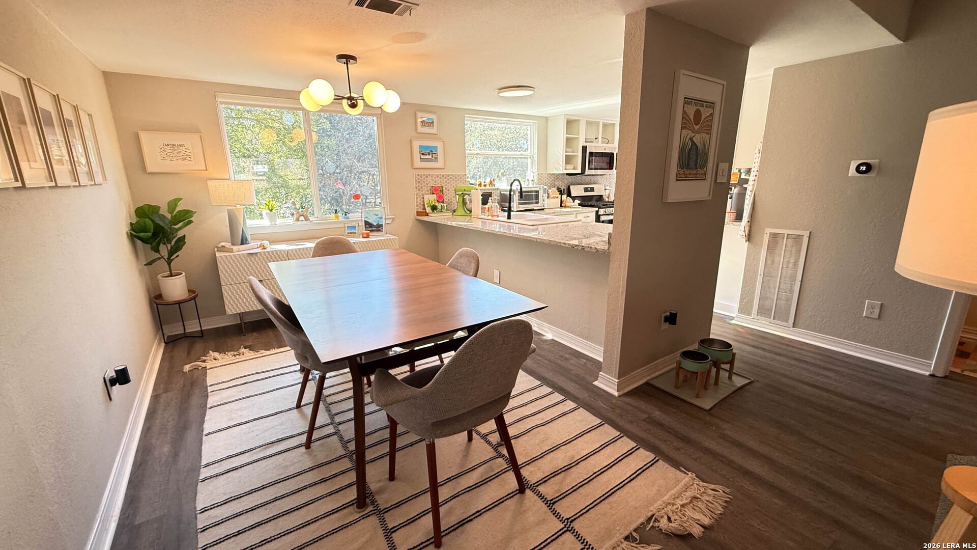 8505 Spring Valley Drive Austin, TX 78736 - Photo 13 of 49 a view of a dining room with furniture window and wooden floor