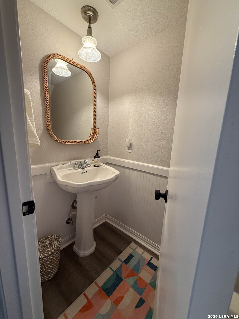 8505 Spring Valley Drive Austin, TX 78736 - Photo 20 of 49 a bathroom with a sink toilet and a mirror