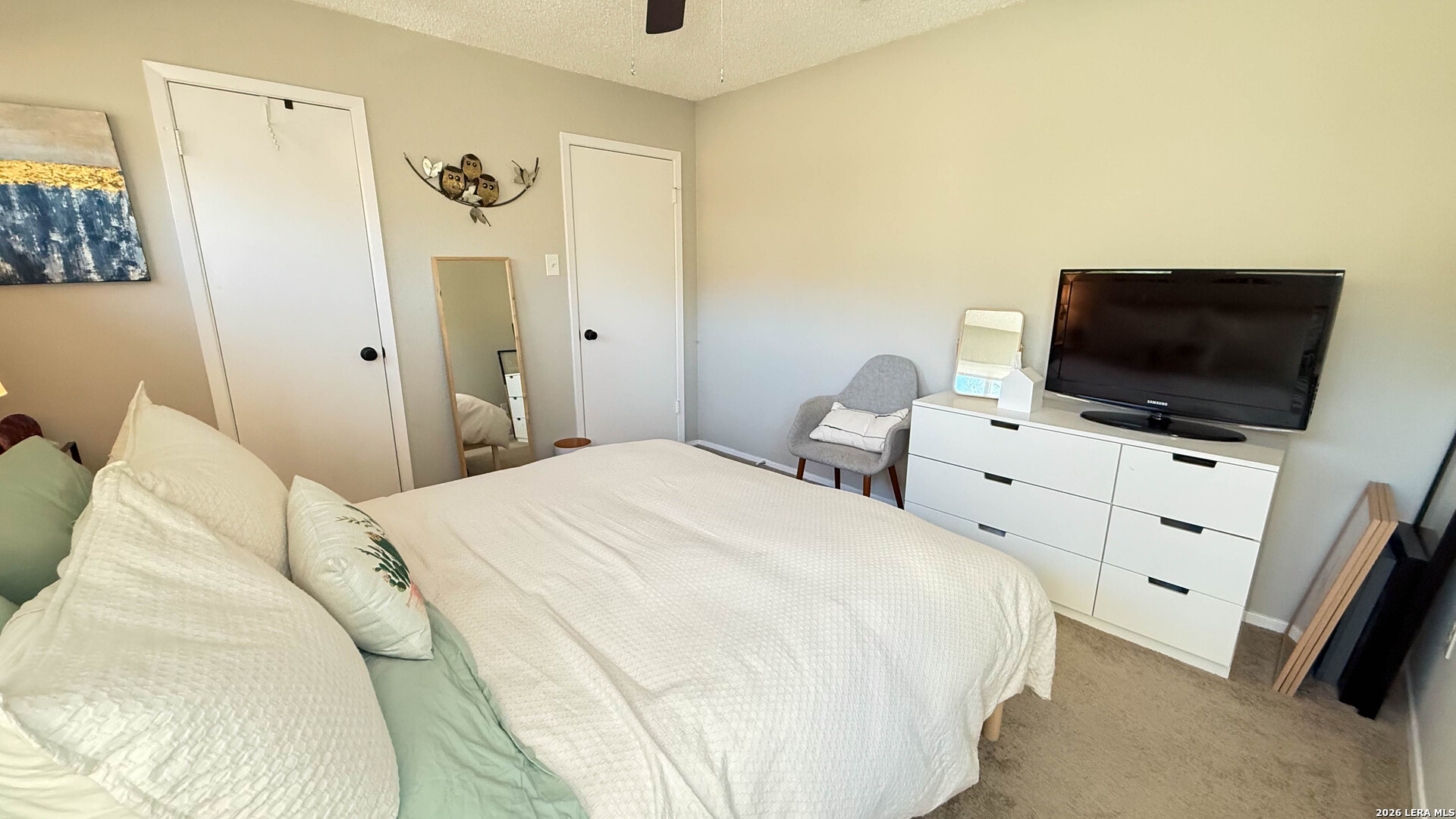 8505 Spring Valley Drive Austin, TX 78736 - Photo 24 of 49 a bedroom with a bed and a flat screen tv