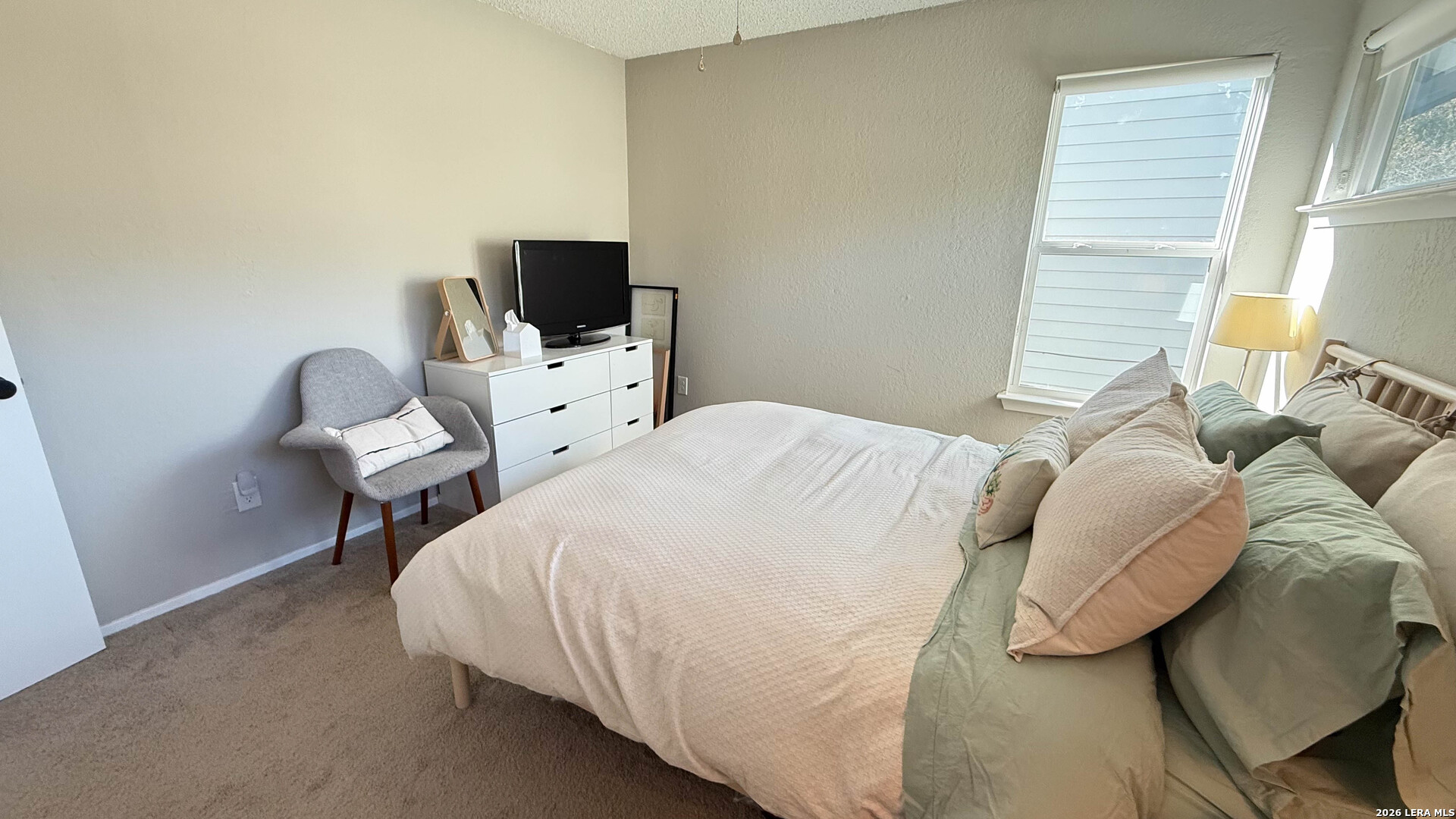 8505 Spring Valley Drive Austin, TX 78736 - Photo 26 of 49 a bedroom with a bed and a flat screen tv