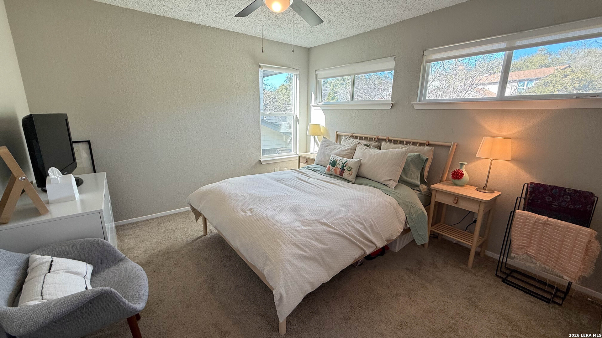 8505 Spring Valley Drive Austin, TX 78736 - Photo 28 of 49 a bedroom with a bed chair and window