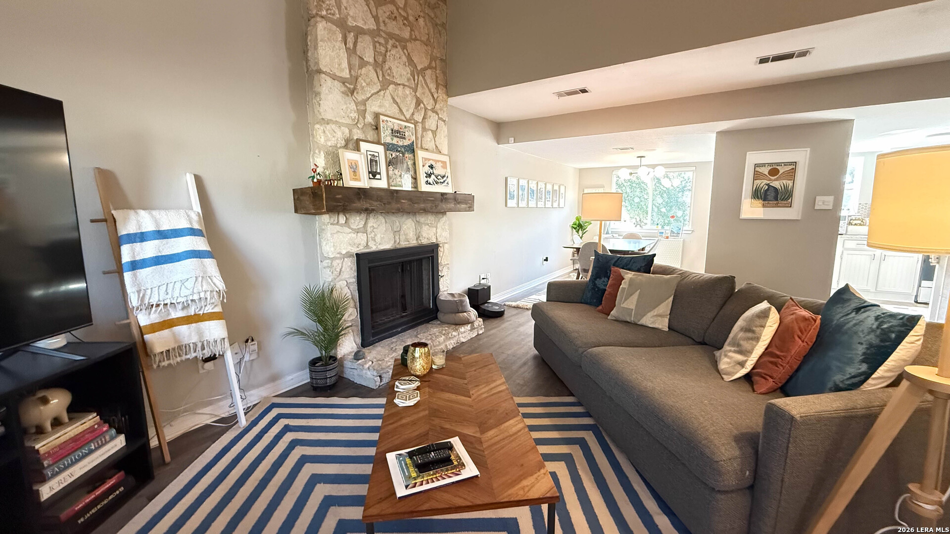 8505 Spring Valley Drive Austin, TX 78736 - Photo 3 of 49 a living room with furniture fireplace and flat screen tv