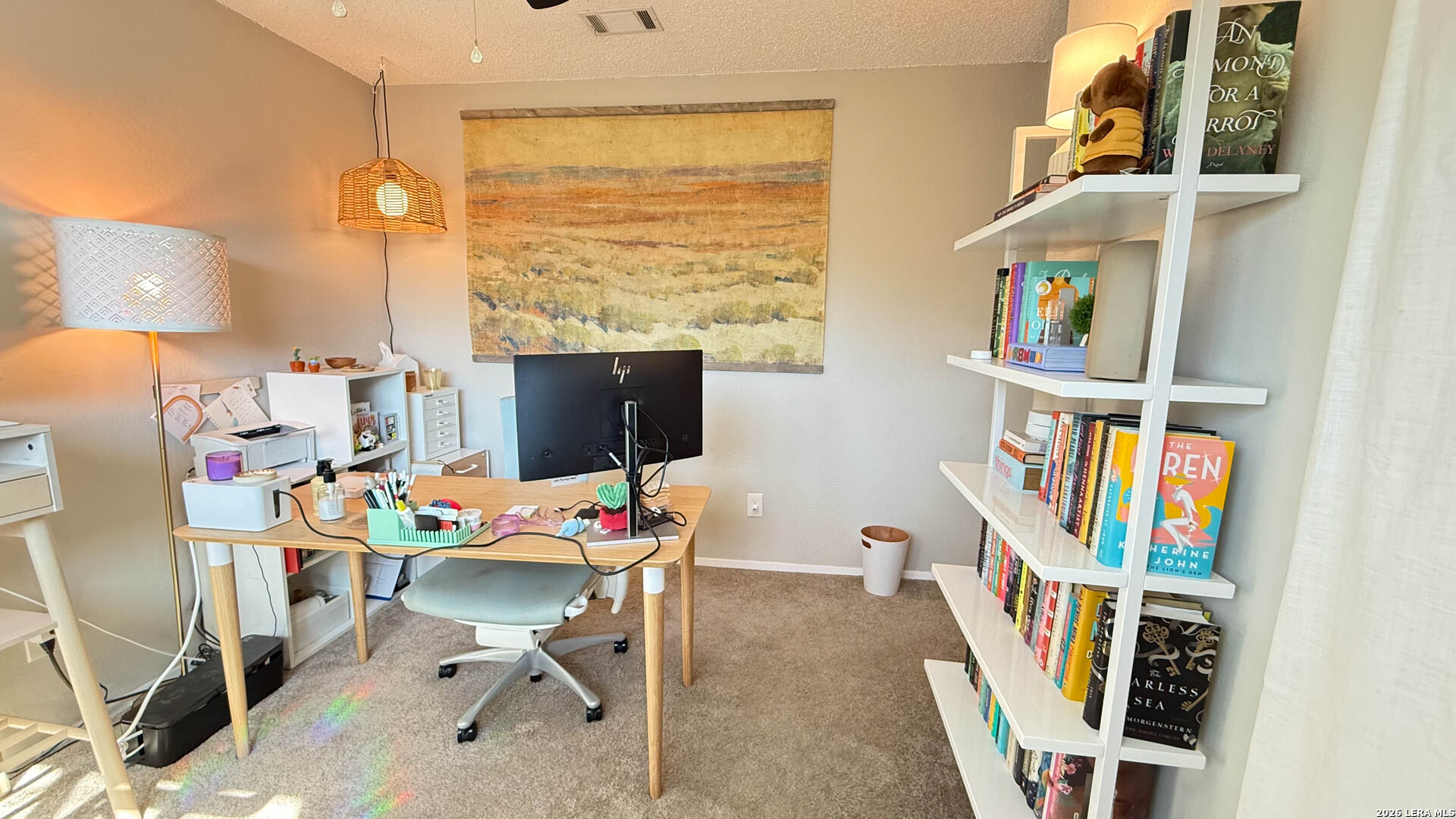 8505 Spring Valley Drive Austin, TX 78736 - Photo 32 of 49 a view of a workspace with furniture and a window