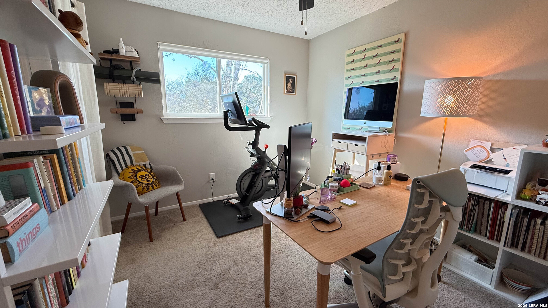 8505 Spring Valley Drive Austin, TX 78736 - Photo 34 of 49 a view of a workspace with furniture and a flat screen tv