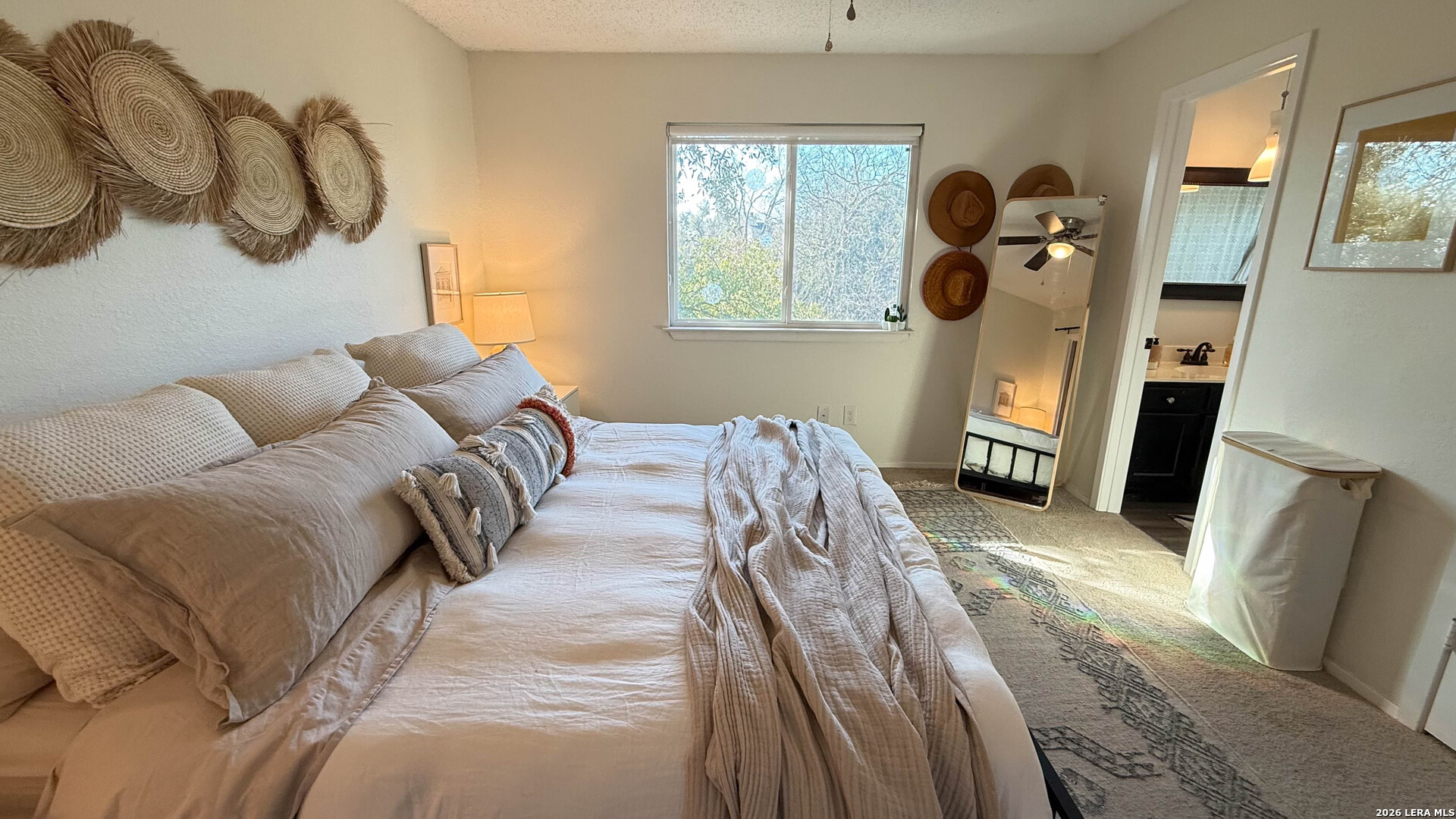 8505 Spring Valley Drive Austin, TX 78736 - Photo 40 of 49 a bed room with a bed mirror and a window