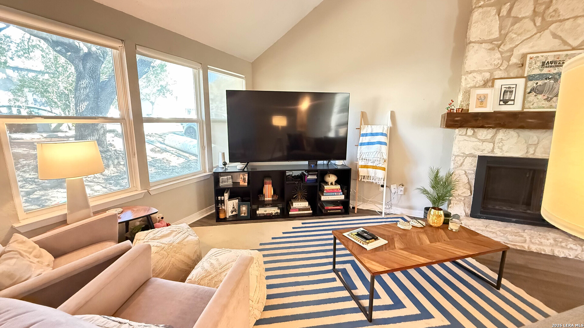 8505 Spring Valley Drive Austin, TX 78736 - Photo 4 of 49 a living room with fireplace furniture and a flat screen tv