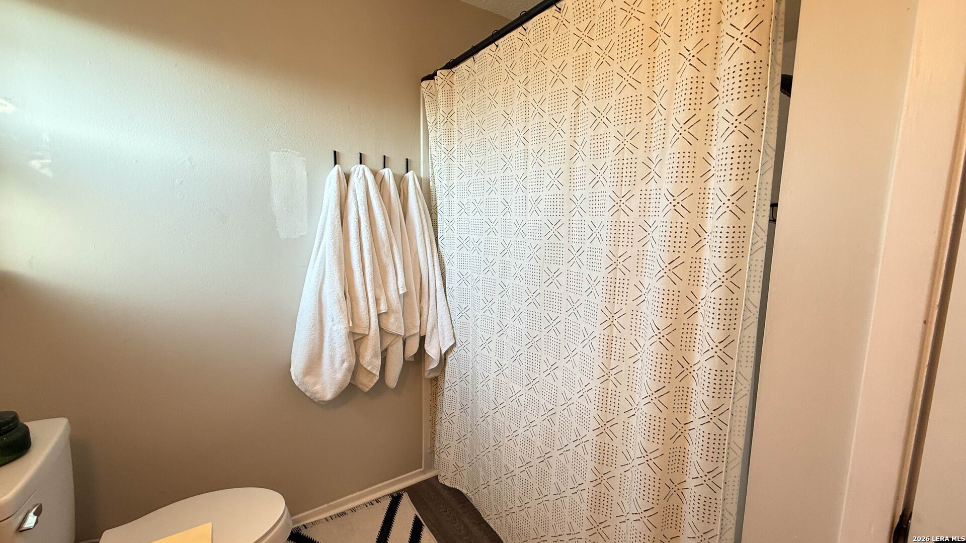 8505 Spring Valley Drive Austin, TX 78736 - Photo 42 of 49 a bathroom with a shower curtain and a shower curtain