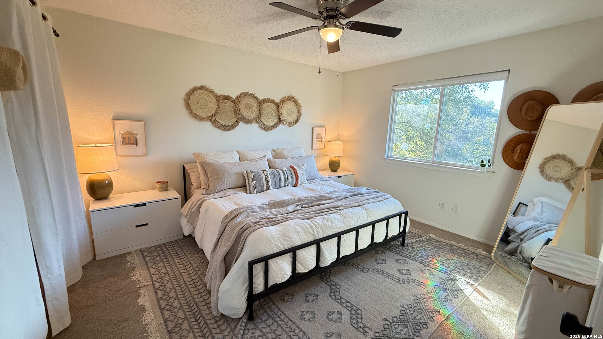 8505 Spring Valley Drive Austin, TX 78736 - Photo 43 of 49 a bedroom with a bed and a window