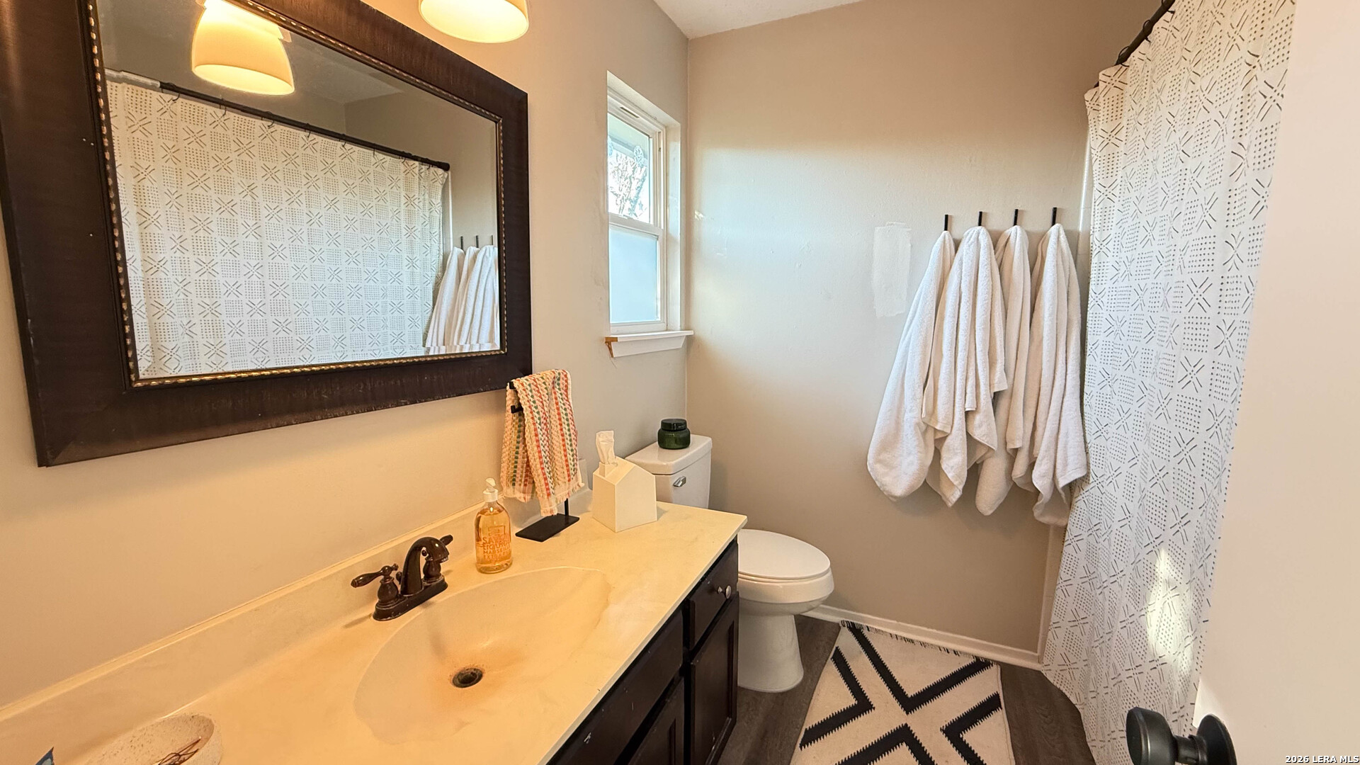 8505 Spring Valley Drive Austin, TX 78736 - Photo 45 of 49 a bathroom with a sink vanity and a mirror