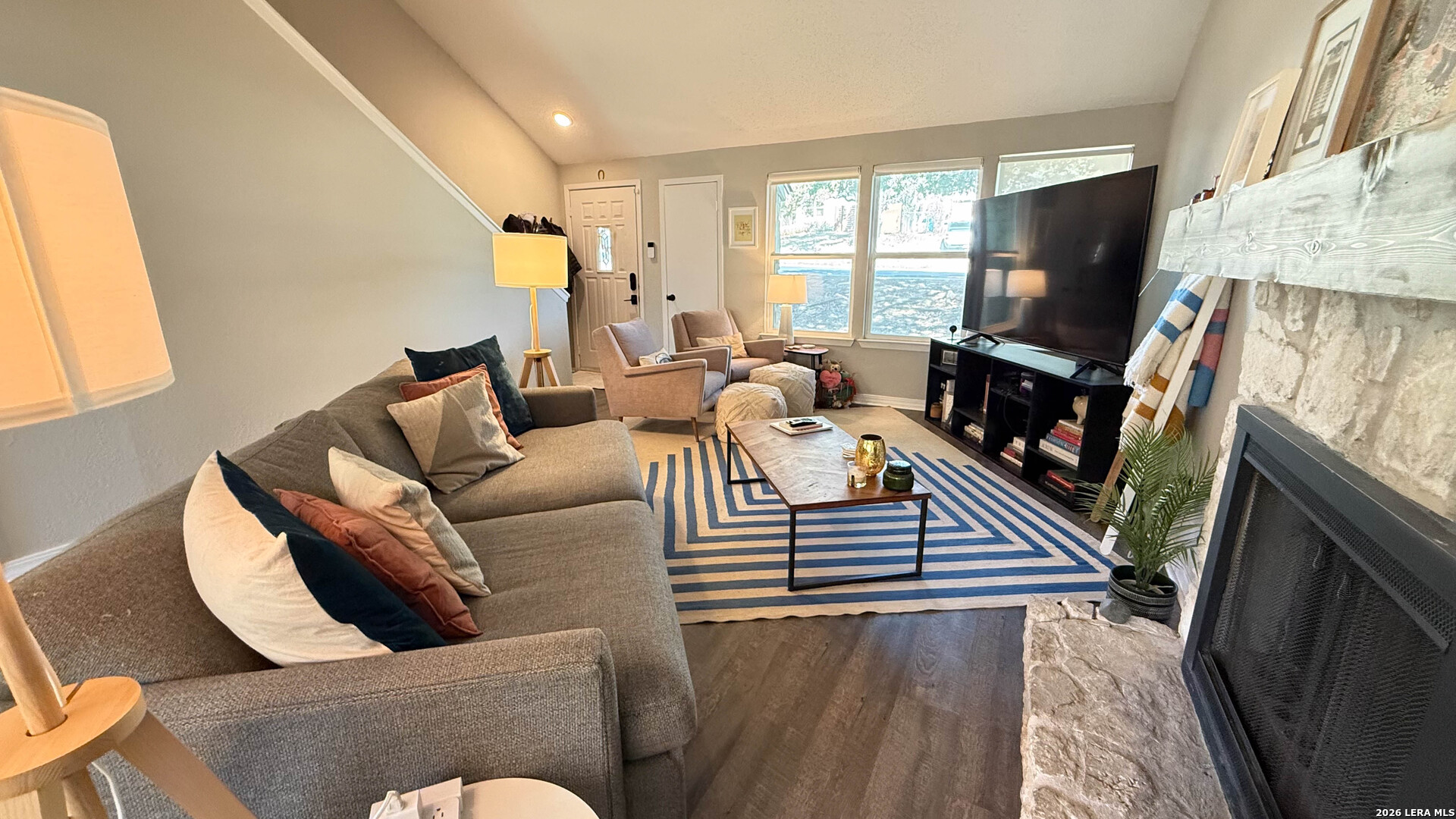 8505 Spring Valley Drive Austin, TX 78736 - Photo 8 of 49 a living room with furniture and a flat screen tv