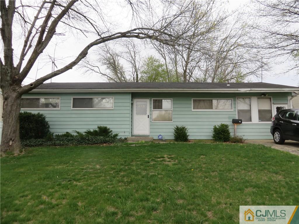 213 Princeton Road Old Bridge, NJ 08859 - Photo 1 of 17 a front view of house with yard and trees
