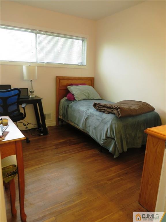 213 Princeton Road Old Bridge, NJ 08859 - Photo 11 of 17 a bedroom with a bed and a window