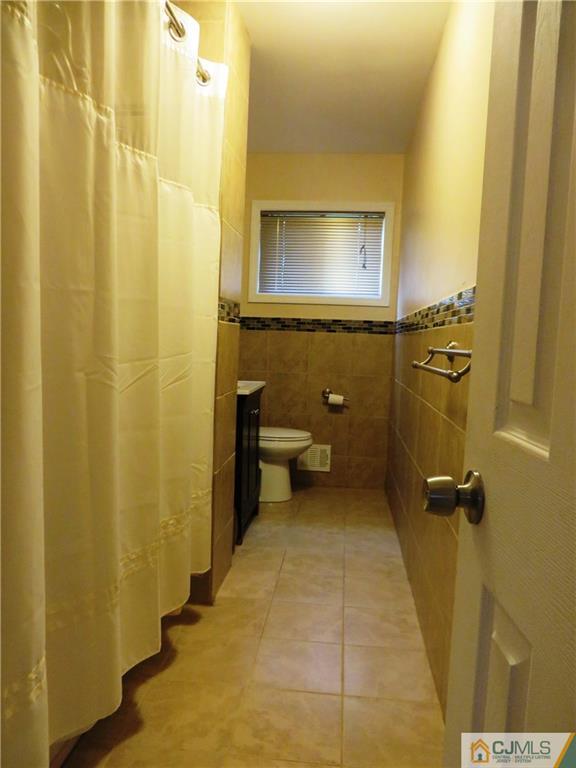 213 Princeton Road Old Bridge, NJ 08859 - Photo 13 of 17 a bathroom with a toilet sink and a shower