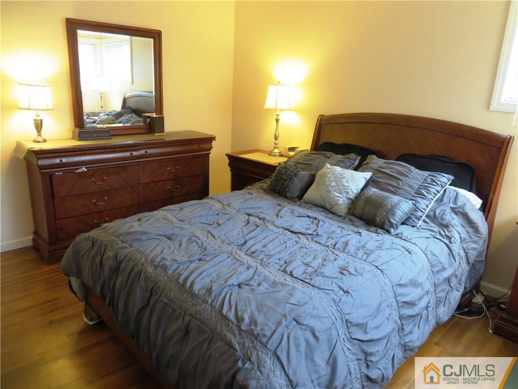 213 Princeton Road Old Bridge, NJ 08859 - Photo 7 of 17 a bedroom with a bed and a window