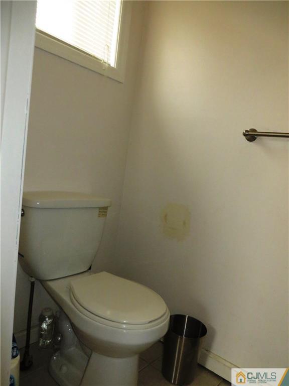 213 Princeton Road Old Bridge, NJ 08859 - Photo 10 of 17 a white toilet sitting next to a shower