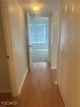 a view of a small space with wooden floor