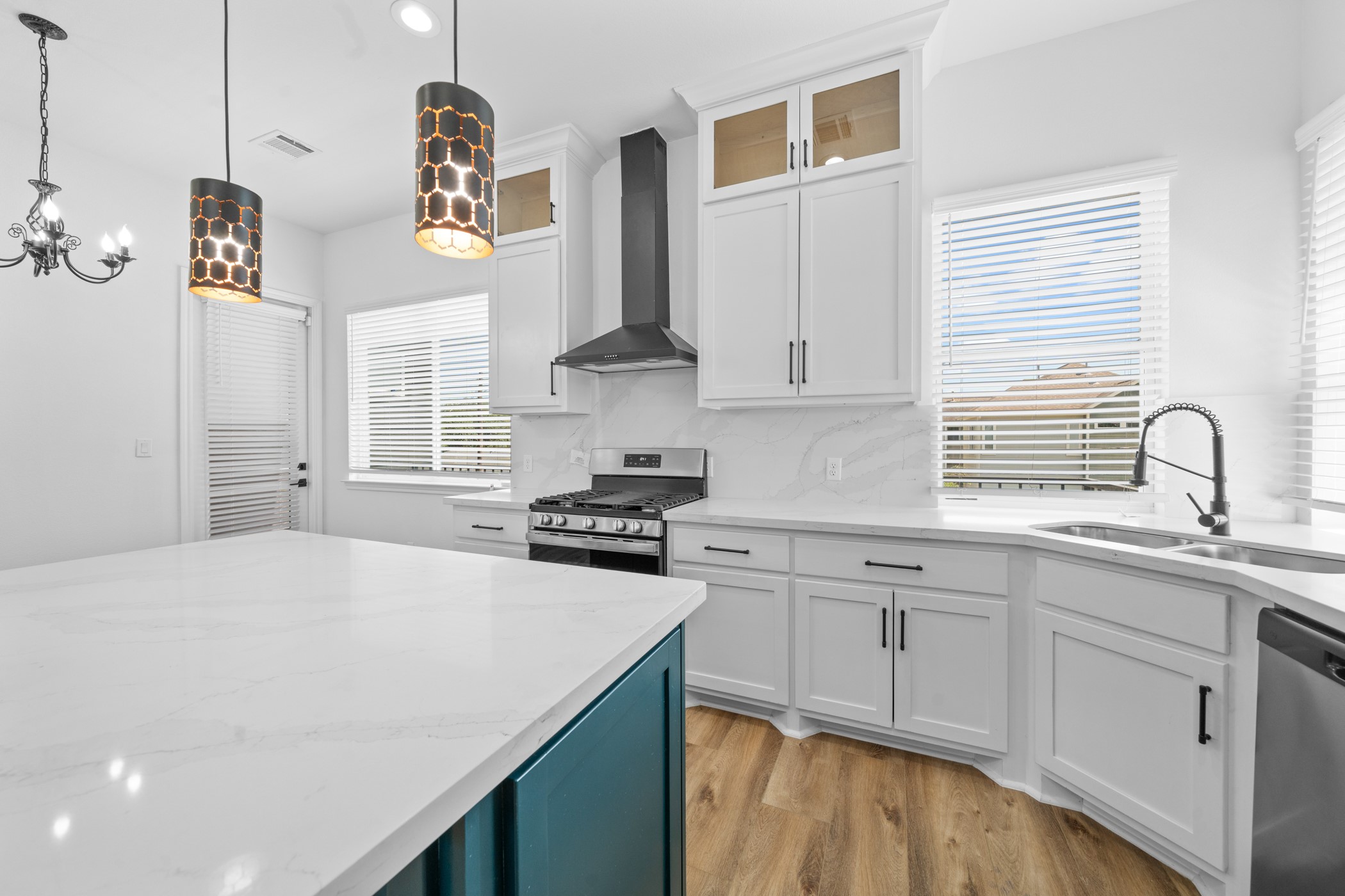 2303 Wipprecht Street Houston, TX 77020 - Photo 9 of 26 a kitchen with granite countertop a sink a stove cabinets and wooden floor