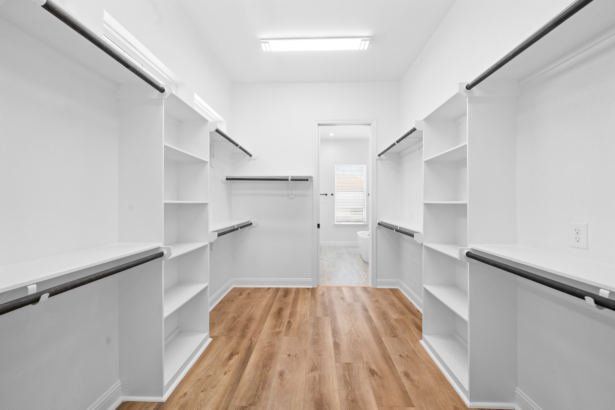 2303 Wipprecht Street Houston, TX 77020 - Photo 12 of 26 a view of a hallway with wooden floor and staircase