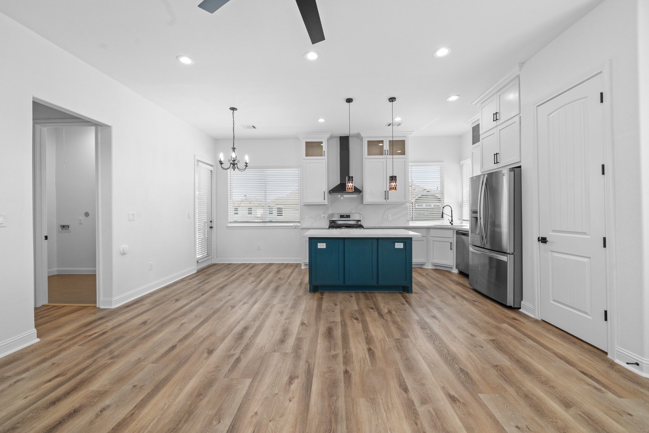 2303 Wipprecht Street Houston, TX 77020 - Photo 7 of 26 a kitchen with stainless steel appliances a sink cabinets and wooden floor