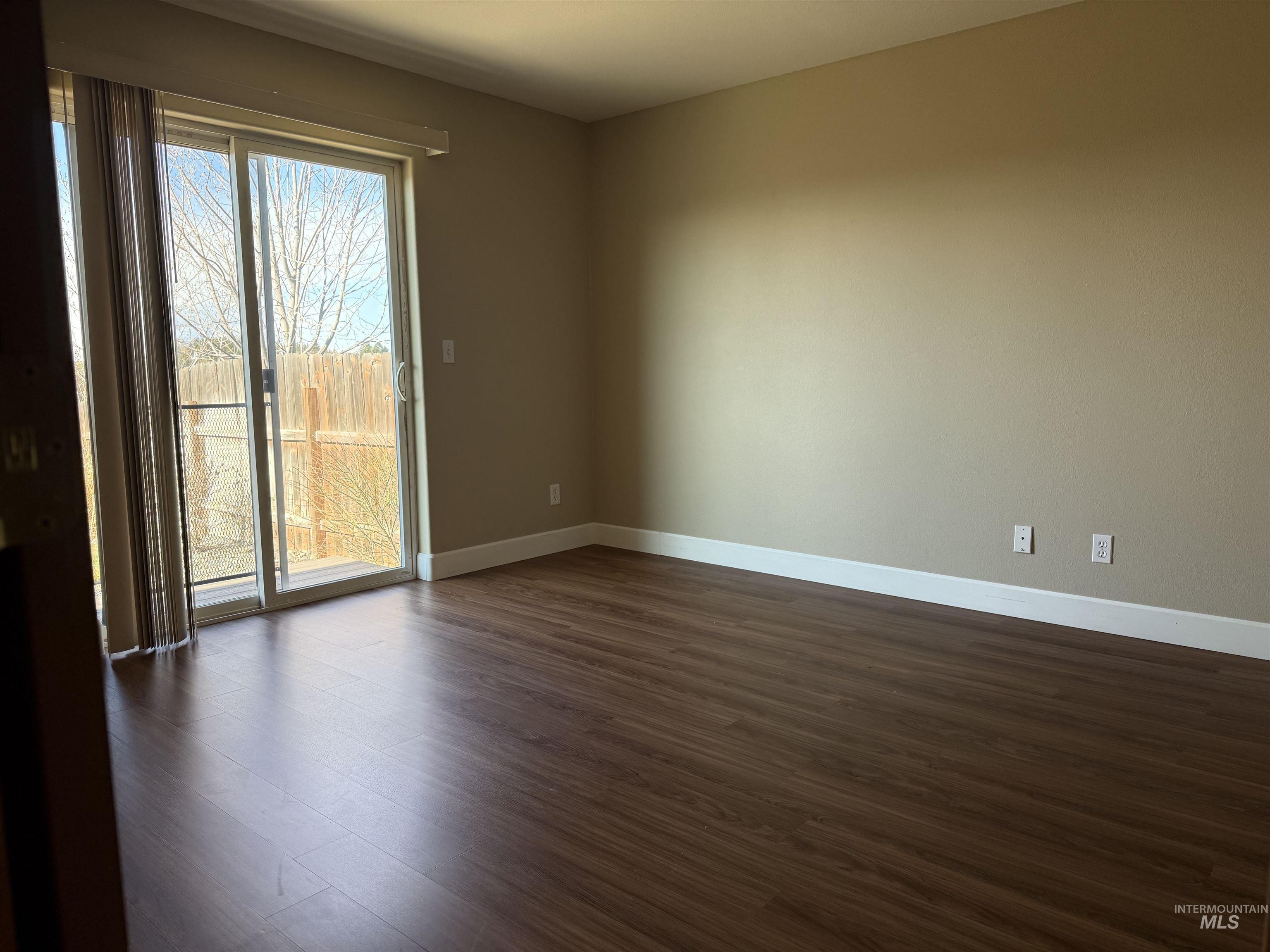 257 Pintail Lane Moscow, ID 83843 - Photo 12 of 28 Spare room featuring dark wood-type flooring and baseboards