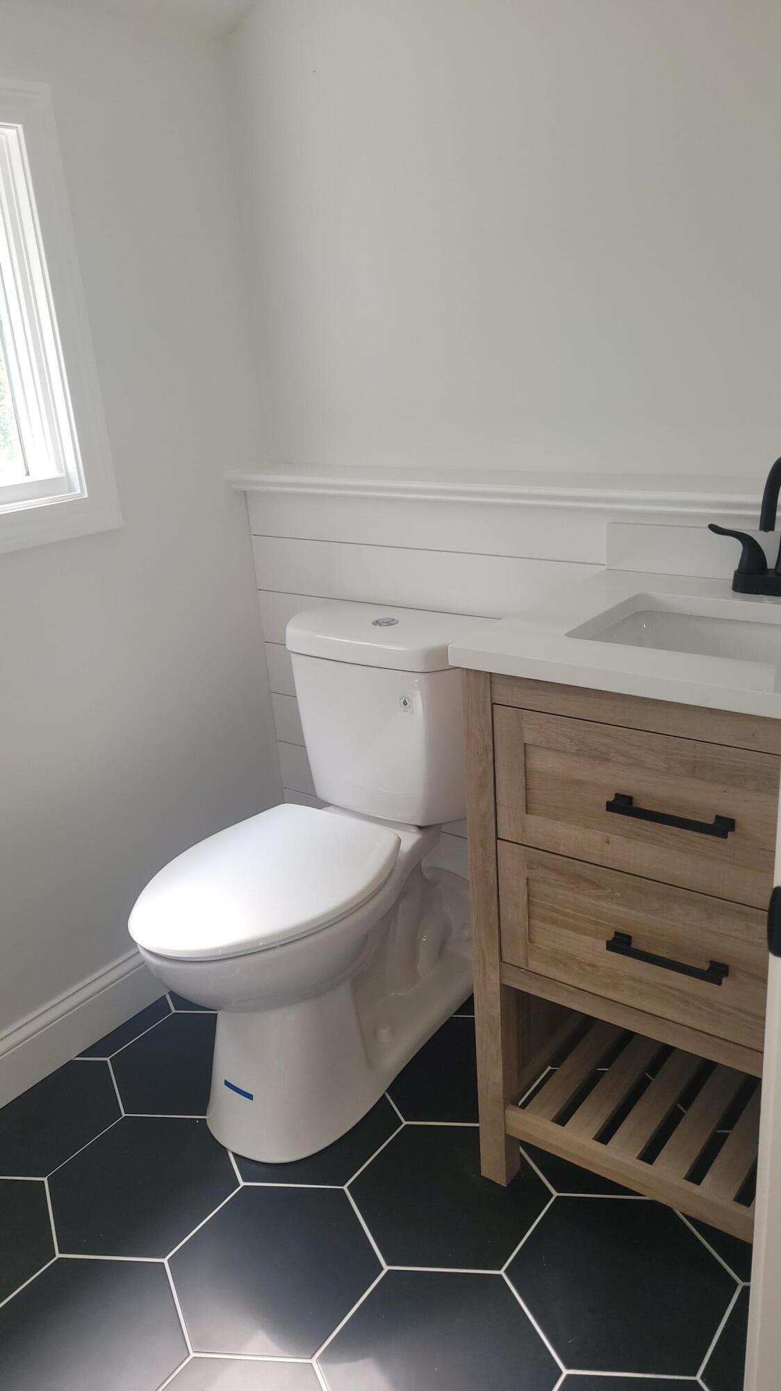 96 Stoney Cliff Road Centerville, MA 02632 - Photo 14 of 36 a bathroom with a toilet and a sink