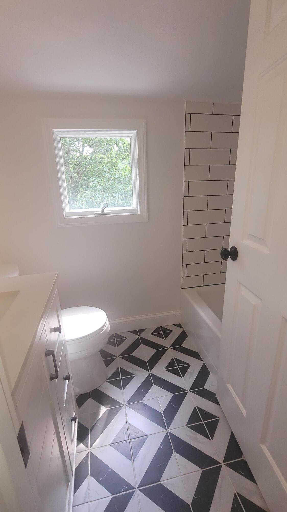 96 Stoney Cliff Road Centerville, MA 02632 - Photo 25 of 36 a bathroom with a toilet a sink and a window