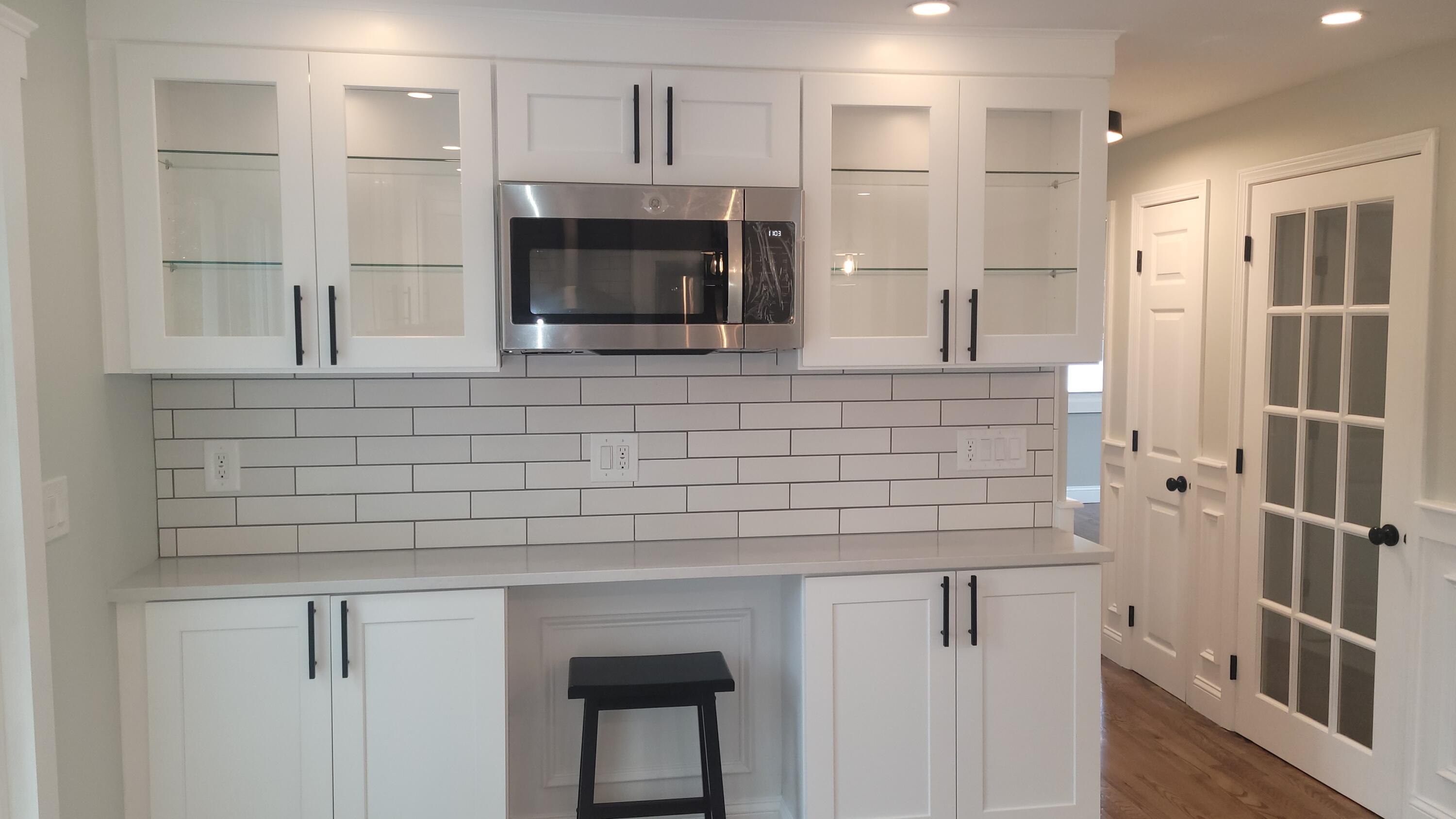 96 Stoney Cliff Road Centerville, MA 02632 - Photo 7 of 36 a kitchen with stainless steel appliances a sink and a refrigerator