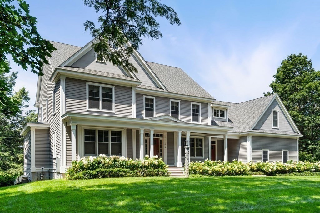 1663 Lowell Road Concord, MA 01742 - Photo 2 of 41 a front view of a house with a garden and trees