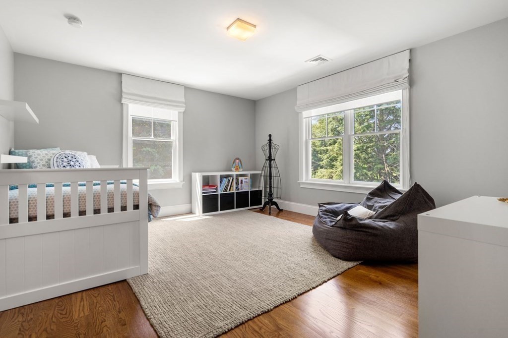 1663 Lowell Road Concord, MA 01742 - Photo 22 of 41 a living room with furniture and a fireplace